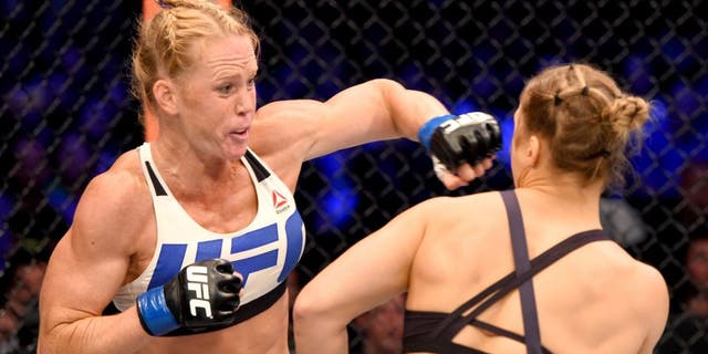 MELBOURNE, AUSTRALIA - NOVEMBER 15: (L-R) Holly Holm of the United States punches Ronda Rousey of the United States in their UFC women's bantamweight championship bout during the UFC 193 event at Etihad Stadium on November 15, 2015 in Melbourne, Australia. (Photo by Josh Hedges/Zuffa LLC/Zuffa LLC via Getty Images)