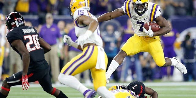 Dec 29, 2015; Houston, TX, USA; LSU Tigers running back Leonard Fournette (7) rushes against the Texas Tech Red Raiders in the first quarter at NRG Stadium. Mandatory Credit: Thomas B. Shea-USA TODAY Sports
