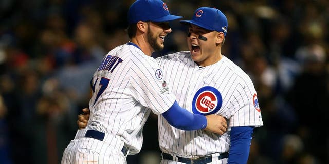 October 13, 2015; Chicago, IL, USA; Chicago Cubs third baseman Kris Bryant (17) and first baseman Anthony Rizzo (44) celebrate the 6-4 victory and against St. Louis Cardinals in game four of the NLDS at Wrigley Field. Mandatory Credit: Jerry Lai-USA TODAY Sports