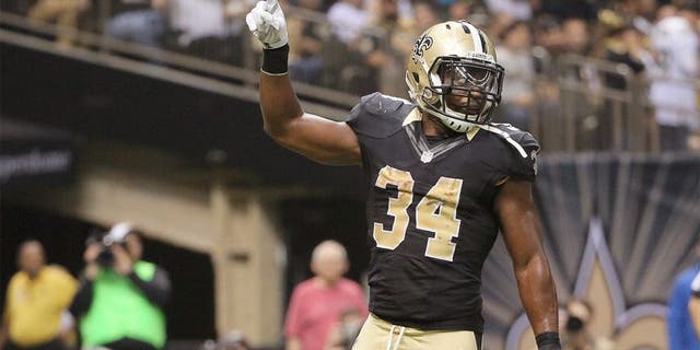 Dec 27, 2015; New Orleans, LA, USA; New Orleans Saints running back Tim Hightower (34) celebrates a touchdown against the Jacksonville Jaguars during the second quarter of a game at the Mercedes-Benz Superdome. Mandatory Credit: Derick E. Hingle-USA TODAY Sports