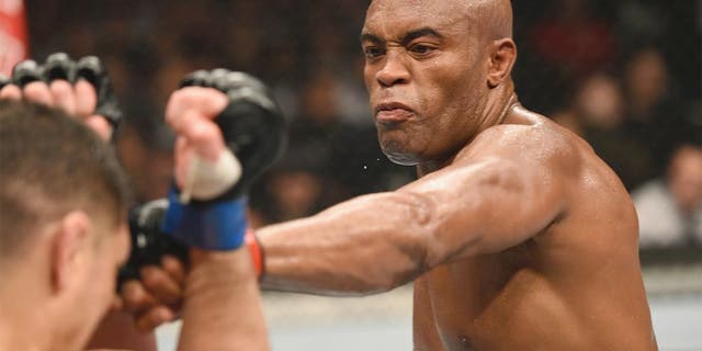 LAS VEGAS, NV - JANUARY 31: (R-L) Anderson Silva punches Nick Diaz in their middleweight bout during the UFC 183 event at the MGM Grand Garden Arena on January 31, 2015 in Las Vegas, Nevada. (Photo by Josh Hedges/Zuffa LLC/Zuffa LLC via Getty Images)