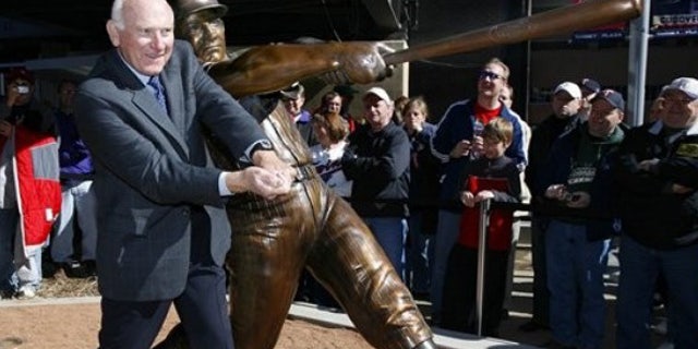 April 3, 2010: Former Minnesota Twins baseball player Harmon Killebrew poses with a statue of him unveiled near Target Field in Minneapolis.