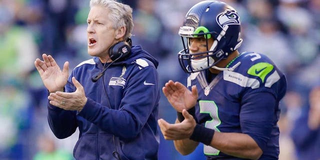 SEATTLE, WA - NOVEMBER 17: Head coach Pete Carroll and quarterback Russell Wilson #3 of the Seattle Seahawks react to a point after touchdown against the Minnesota Vikings at CenturyLink Field on November 17, 2013 in Seattle, Washington. (Photo by Otto Greule Jr/Getty Images)