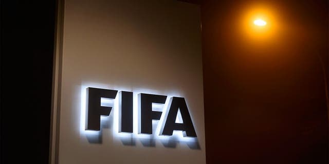 A sign of the FIFA is seen at the entrance of its headquarters on December 3, 2015 in Zurich. The multi-million dollar corruption scandal engulfing FIFA widened on December 3, with 16 people indicted by US justice officials who pledged an unremitting crackdown on an "outrageous" betrayal of trust. / AFP / FABRICE COFFRINI (Photo credit should read FABRICE COFFRINI/AFP/Getty Images)