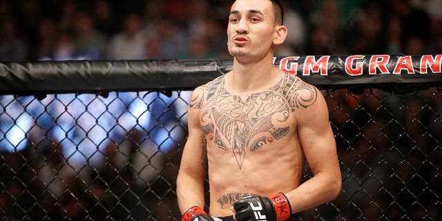 LAS VEGAS, NV - DECEMBER 12: Max Holloway waits for the start of his featherweight fight against Jeremy Stephens during UFC 194 at MGM Grand Garden Arena on December 12, 2015 in Las Vegas, Nevada. (Photo by Steve Marcus/Getty Images)