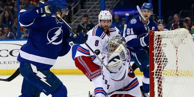 Dec 30, 2015; Tampa, FL, USA; New York Rangers goalie Henrik Lundqvist (30) makes a save from Tampa Bay Lightning center Vladislav Namestnikov (90) during the second period at Amalie Arena. Mandatory Credit: Kim Klement-USA TODAY Sports
