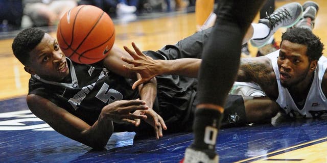 Dec 31, 2015; Indianapolis, IN, USA; Providence College Friars forward Rodney Bullock(5) and Butler University Bulldogs forward Tyler Wideman (4) battle for the ball at Hinkle Fieldhouse. Mandatory Credit: Thomas Joseph-USA TODAY Sports