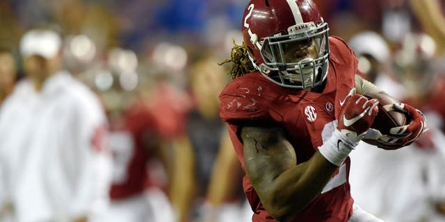 Dec 5, 2015; Atlanta, GA, USA; Alabama Crimson Tide running back Derrick Henry (2) runs against the Florida Gators during the third quarter of the 2015 SEC Championship Game at the Georgia Dome. Mandatory Credit: John David Mercer-USA TODAY Sports