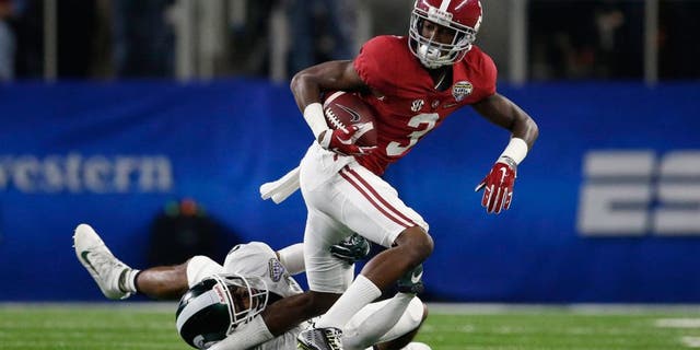 Dec 31, 2015; Arlington, TX, USA; Alabama Crimson Tide wide receiver Calvin Ridley (3) is tackled by Michigan State Spartans cornerback Darian Hicks (2) in the first quarter in the 2015 CFP semifinal at the Cotton Bowl at AT&T Stadium. Mandatory Credit: Matthew Emmons-USA TODAY Sports