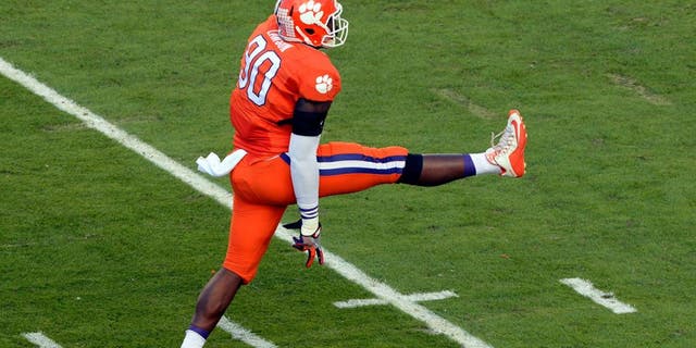 Dec 31, 2015; Miami Gardens, FL, USA; Clemson Tigers defensive end Shaq Lawson (90) reacts after sacking Oklahoma Sooners quarterback Baker Mayfield (not pictured) during the first quarter of the 2015 CFP semifinal at the Orange Bowl at Sun Life Stadium. Mandatory Credit: Tommy Gilligan-USA TODAY Sports