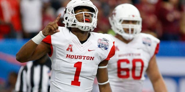Dec 31, 2015; Atlanta, GA, USA; Houston Cougars quarterback Greg Ward Jr. (1) celebrates after scoring a touchdown in the second quarter against the Florida State Seminoles in the 2015 Chick-fil-A Peach Bowl at the Georgia Dome. Mandatory Credit: Jason Getz-USA TODAY Sports