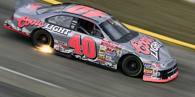15 Oct 2001: Sterling Marlin catches speed and some fire as he drives the #40 Gnassi Racing Dodge Intrepid R/T during the Old Dominion 500, part of the Winston Cup Nascar Series race at Martinsville Speedway in Martinsville, Virginia. DIGITAL IMAGE Mandatory Credit: Donald Miralle/ALLSPORT