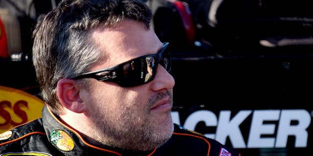 RICHMOND, VA - SEPTEMBER 11: Tony Stewart, driver of the #14 Bass Pro Shops/Mobil 1 Chevrolet, looks on during qualifying for the NASCAR Sprint Cup Series Federated Auto Parts 400 at Richmond International Raceway on September 11, 2015 in Richmond, Virginia. (Photo by Jonathan Moore/NASCAR via Getty Images)