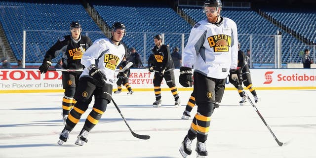FOXBORO, MA - DECEMBER 31: (l-r) Zach Trotman #62 and Jimmy Hayes #11 of the Boston Bruins skate during the practice session at Gillette Stadium on December 31, 2015 in Foxboro, Massachusetts. (Photo by Maddie Meyer/Getty Images)