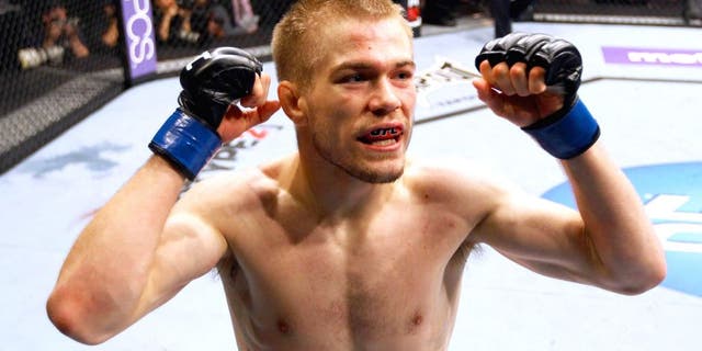 ATLANTA, GA - APRIL 21: Michael McDonald celebrates defeating Miguel Angel Torres by knockout in the first round during their Bantamweight bout for UFC 145 at Philips Arena on April 21, 2012 in Atlanta, Georgia. (Photo by Al Bello/Zuffa LLC/Zuffa LLC via Getty Images)