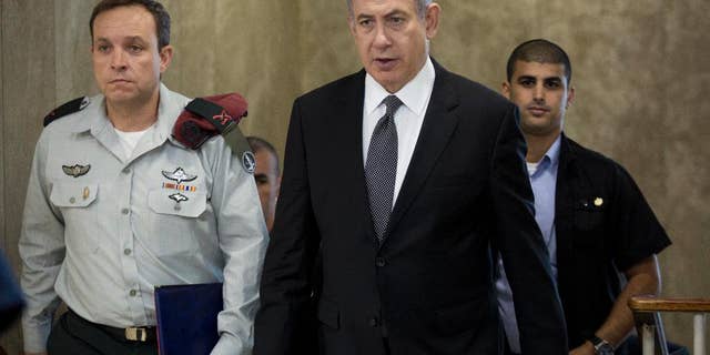 Israeli Prime Minister Benjamin Netanyahu attends the weekly cabinet meeting at his office in Jerusalem, Israel, Sunday, July 17, 2016. (Abir Sultan, Pool via AP)