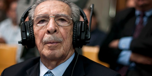 Guatemala's former dictator Jose Efrain Rios Montt wears headphones as he listens to the verdict in his genocide trial in Guatemala City, Friday, May 10, 2013. The Guatemalan court convicted Rios Montt on charges of genocide and crimes against humanity, sentencing him to 80 years in prison. The 86-year-old former general is the first former Latin American leader ever found guilty of such a charge. The war between the government and leftist rebels cost more than 200,000 lives and ended in peace accords in 1996. (AP Photo/Luis Soto)