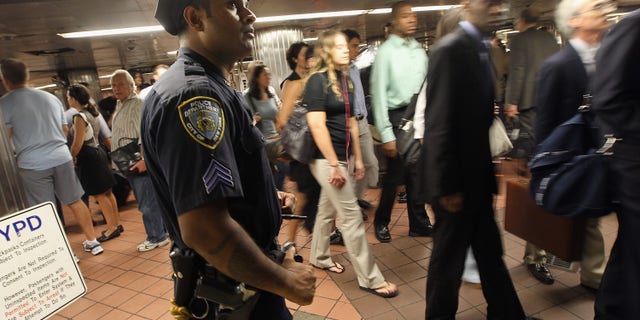 NEW YORK, NY - SEPTEMBER 09: A New York Police Department (NYPD) officer keeps watch during the morning commute at Grand Central Terminal on September 9, 2011 in New York City. Security is being tightened in New York and Washington, DC, following the detection of a possible terror threat tied to the tenth anniversary of the 9/11 terror attacks. New York City and the nation are preparing for the 10th anniversary of the terrorist attacks on lower Manhattan, which resulted in the deaths of 2,753 people at the World Trade Center. (Photo by Mario Tama/Getty Images)