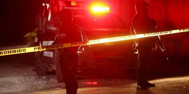 State and federal police on Feb. 10, 2017, guard a crime scene in Tepic, Nayarit where Juan Francisco Padron Sanchez, a suspected regional leader of the Beltran Leyva drug cartel, was killed in a shootout with federal forces.