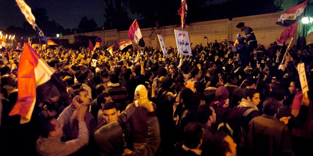 Dec. 4, 2012: Egyptian protesters chant anti Muslim Brotherhood slogans during a demonstration in front of the presidential palace in Cairo, Egypt.