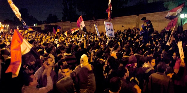 Dec. 4, 2012: Egyptian protesters chant anti Muslim Brotherhood slogans during a demonstration in front of the presidential palace in Cairo, Egypt.