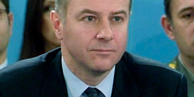 In this photo made available by NATO, in this Dec. 14, 2006 file photo, Serbia's Ambassador to NATO Branislav Milinkovic is seen during a meeting at NATO headquarters in Brussels, Belgium.