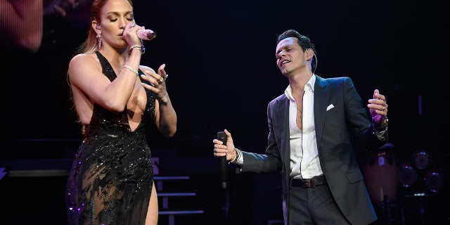 Jennifer Lopez (L) performs onstage with Marc Anthony at Radio City Music Hall on August 27, 2016 in New York City.