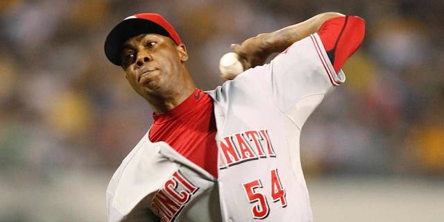 Sep 20, 2013; Pittsburgh, PA, USA; Cincinnati Reds relief pitcher Aroldis Chapman (54) pitches against the Pittsburgh Pirates during the tenth inning at PNC Park. The Cincinnati Reds won 6-5 in ten innings. Mandatory Credit: Charles LeClaire-USA TODAY Sports