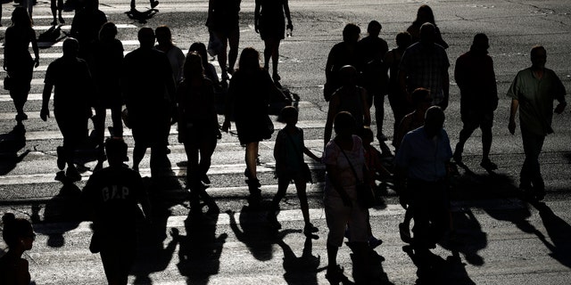 People cross Las Vegas Boulevard as the sun beats down, Tuesday, June 20, 2017, in Las Vegas. The first day of summer is forecast to bring some of the worst heat the southwestern U.S. has seen in years. (AP Photo/John Locher)
