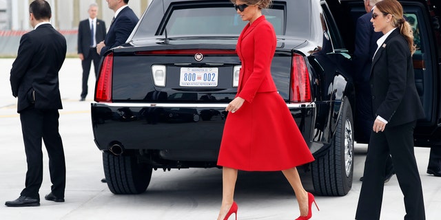U.S. President Donald Trump and first lady Melania Trump part on the tarmac after they arrive on Air Force One at Orly Airport south of Paris, Thursday, July 13, 2017. The president and first lady will attend the Bastille Day parade on the Champs Elysees avenue in Paris, France, on Friday, July 14, 2017. (AP Photo/Carolyn Kaster)