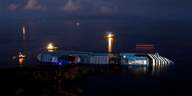 Jan. 23, 2012: The grounded cruise ship Costa Concordia lies on its side off the Tuscan island of Giglio, Italy.
