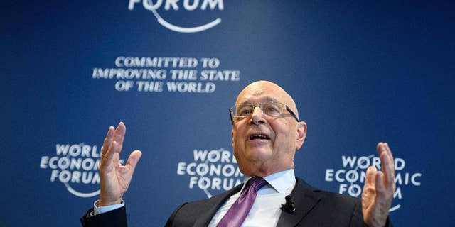 German Klaus Schwab, founder and president of the World Economic Forum, WEF, gestures during a press conference, in Cologny near Geneva, Switzerland, Tuesday, Jan. 10, 2017. (Laurent Gillieron/Keystone via AP)