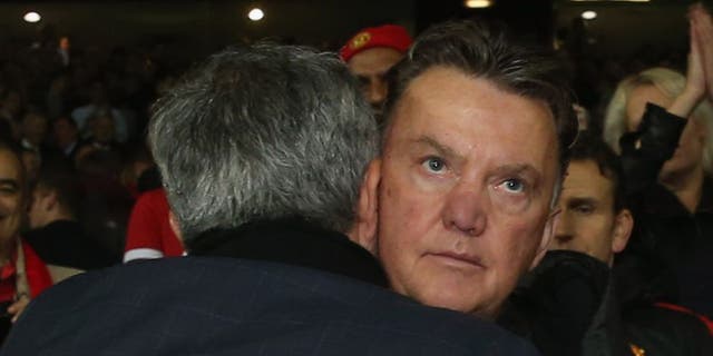 MANCHESTER, ENGLAND - OCTOBER 26: Manager Louis van Gaal of Manchester United and Manager Jose Mourinho of Chelsea embrace after the Barclays Premier League match between Manchester United and Chelsea at Old Trafford on October 26, 2014 in Manchester, England. (Photo by John Peters/Man Utd via Getty Images)