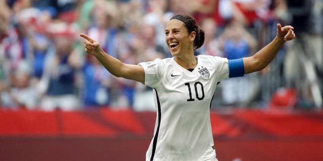 Carli Lloyd of the U.S celebrates scoring her third goal against Japan during the first half of the FIFA Women's World Cup soccer championship in Vancouver, British Columbia, Canada.