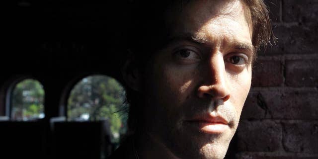 FILE - In this May 27, 2011, file photo shows American Journalist James Foley, of Rochester, N.H., as he poses for a photo in Boston. The beheading of Foley has forced a new debate over how the United States balances its unyielding policy against paying ransom to terrorist groups and saving the lives of Americans being held hostage by some of the world’s most dangerous extremists. (AP Photo/Steven Senne, File)