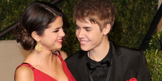 WEST HOLLYWOOD, CA - FEBRUARY 27: Singer/actress Selena Gomez and singerJustin Bieber arrive at the Vanity Fair Oscar party hosted by Graydon Carter held at Sunset Tower on February 27, 2011 in West Hollywood, California. (Photo by Craig Barritt/Getty Images)