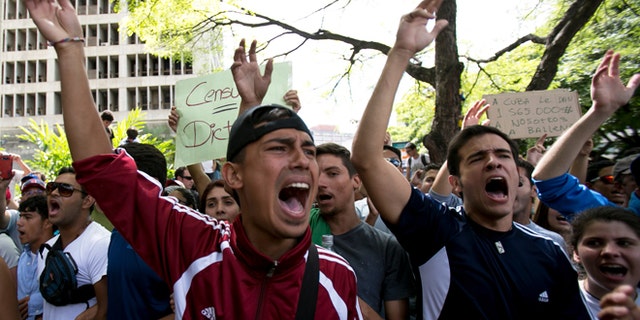 Feb. 17, 2014: Students shout slogans against Venezuela's President Nicolas Maduro during a march to Venezuelan Telecommunications Regulator Office or CONATEL in Caracas, Venezuela.