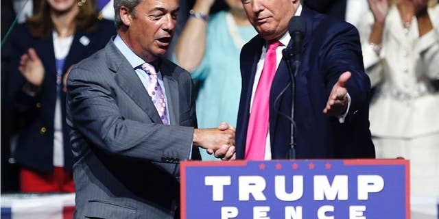 FILE - In this is a Wednesday, Aug. 24, 2016 file photo, Republican presidential candidate Donald Trump, right, welcomes pro-Brexit British politician Nigel Farage, to speak at a campaign rally in Jackson, Miss. Farage says he will attend Donald Trump's inauguration as U.S. president. Farage, one of Trump's strongest U.K. supporters, told Sky News that he had been invited by Mississippi Gov. Phil Bryant. He called the Jan. 20 ceremony in Washington, DC "a great, historic event" and Trump's election "a political revolution." (AP Photo/Gerald Herbert, File)