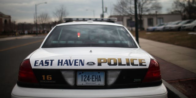 EAST HAVEN, CT - FEBRUARY 01:  An East Haven Police car is viewed on February 1, 2012 in East Haven, Connecticut. Following an investigation by the FBI, four East Haven police officers were arrested last week and accused of abusing Latinos in the working class community of 28,000 people which was nearly predominately white a generation ago. A recent civil rights investigation which was released last month revealed a pattern of discriminatory policing East Haven and the town has been warned by the U.S. Justice Department to make reforms. The arrested officers have been accused of subjecting Hispanics to beatings and false arrests among other things. Currently East Haven's Latino population is around 10 percent.  (Photo by Spencer Platt/Getty Images)
