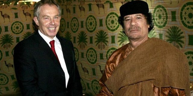 Former British Prime Minister Tony Blair and Libyan leader Muammar Qaddafi meet in 2007 (AP)