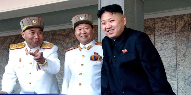 FILE: Undated: North Korean leader Kim Jong Un, (r.), with the Korean People's Army senior officers, preparing a satellite launch.