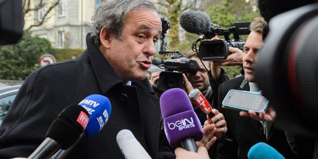 UEFA president and FIFA vice president Michel Platini speaks to the press as he arrives at the Court of Arbitration for Sport (CAS) to appeal against a 90-day suspension in Lausanne on December 8, 2015. The appeal is part of a new campaign by Platini to get back into the election for a new FIFA leader on February 26. / AFP / FABRICE COFFRINI (Photo credit should read FABRICE COFFRINI/AFP/Getty Images)