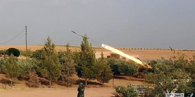 Kurdish-led forces in Manbij targeted by an ISIS missile, in a July image.