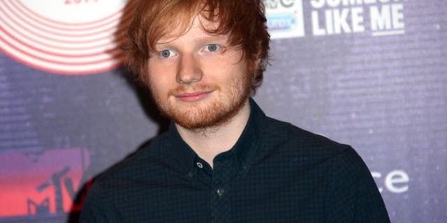 FILE - In this Nov. 9, 2014 file photo, singer-songwriter Ed Sheeran arrives for the 2014 MTV European Music Awards in Glasgow.