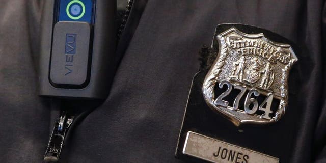 Dec. 3, 2014: A police body camera is seen on an officer during a news conference.