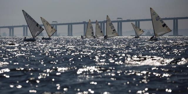 FILE - In this Aug. 3, 2014, file photo, athletes of the Finn class compete during the first test event for the Rio 2016 Olympic Games at the Guanabara Bay in Rio de Janeiro, Brazil.