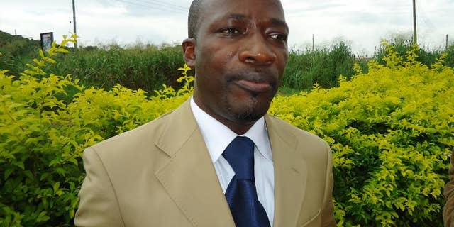 Charles Ble Goude, a former minister in the ousted Ivory Coast regime, speaks to a journalist somewhere close to the Togo-Benin border on June 25, 2012