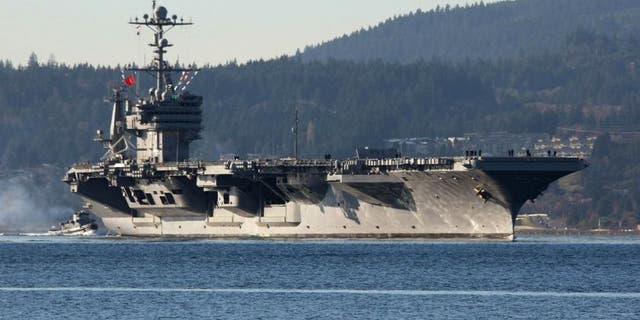 Dec. 1, 2014: FILE - In this photo Dec. 1, 2014 file photo, the aircraft carrier USS John Stennis seen near Bremerton, Wash.