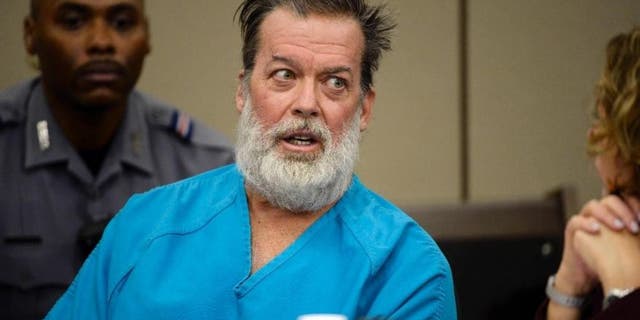 Dec. 9, 2015: Robert Lewis Dear, middle, talks during a court appearance in Colorado Springs, Colo.