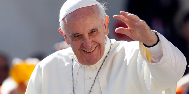 FILE - In this Sept. 18, 2013 file photo, Pope Francis waves to faithful as he arrives for his weekly general audience in St. Peter's Square at the Vatican. Pope Francis convenes his parallel cabinet on Tuesday, Oct. 1, 2013, for a first round of talks on reforming the Catholic Church, bringing eight cardinals from around the globe together in a novel initiative to get local church leaders involved in helping make decisions for the 1.2-billion strong universal Catholic Church. (AP Photo/Riccardo De Luca, File)